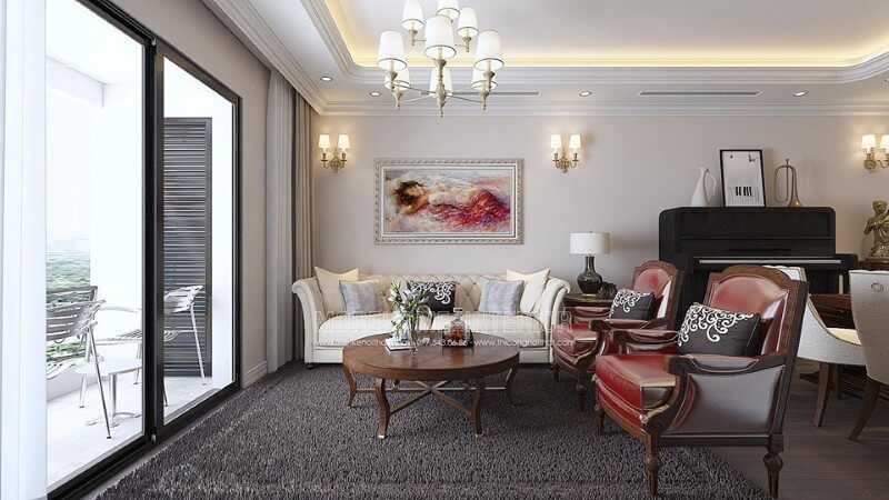 Phòng khách tân cổ điển với gam màu thật vintage của cặp ghế đơn sofa da màu đỏ khung gỗ với đường nét họa tiết hoàng gia mang Mẫu nội thất chung cư đẹp