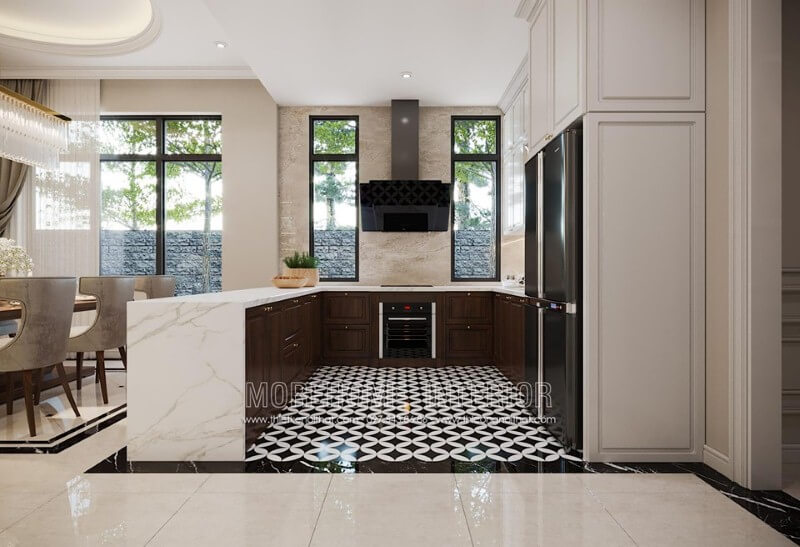 Cánh tủ bếp dưới gỗ óc chó tạo điểm nhấn sang trọng trong không gian bếp. Thiết kế tủ bếp biệt thự sang trọng